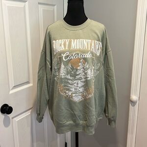 Rebellious One Green Crew Neck Sweater with Mountain Graphic